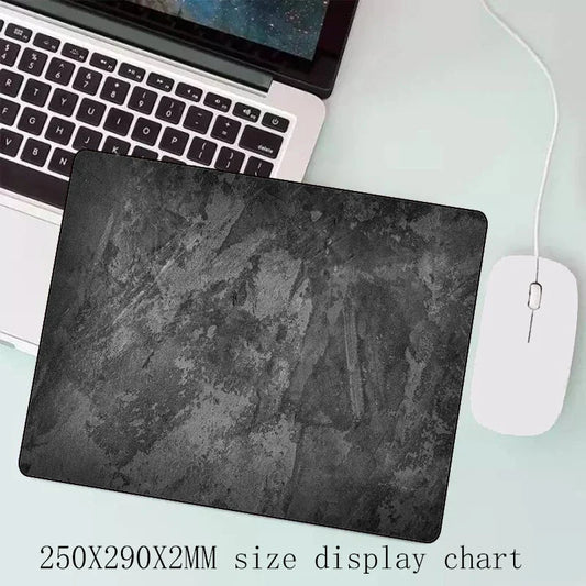 Gray desktop keyboard mouse pad