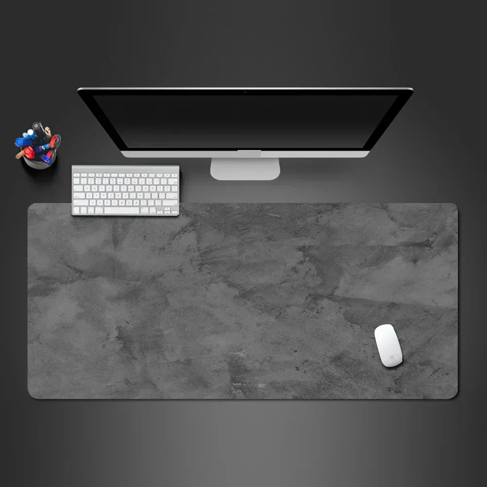 Gray desktop keyboard mouse pad